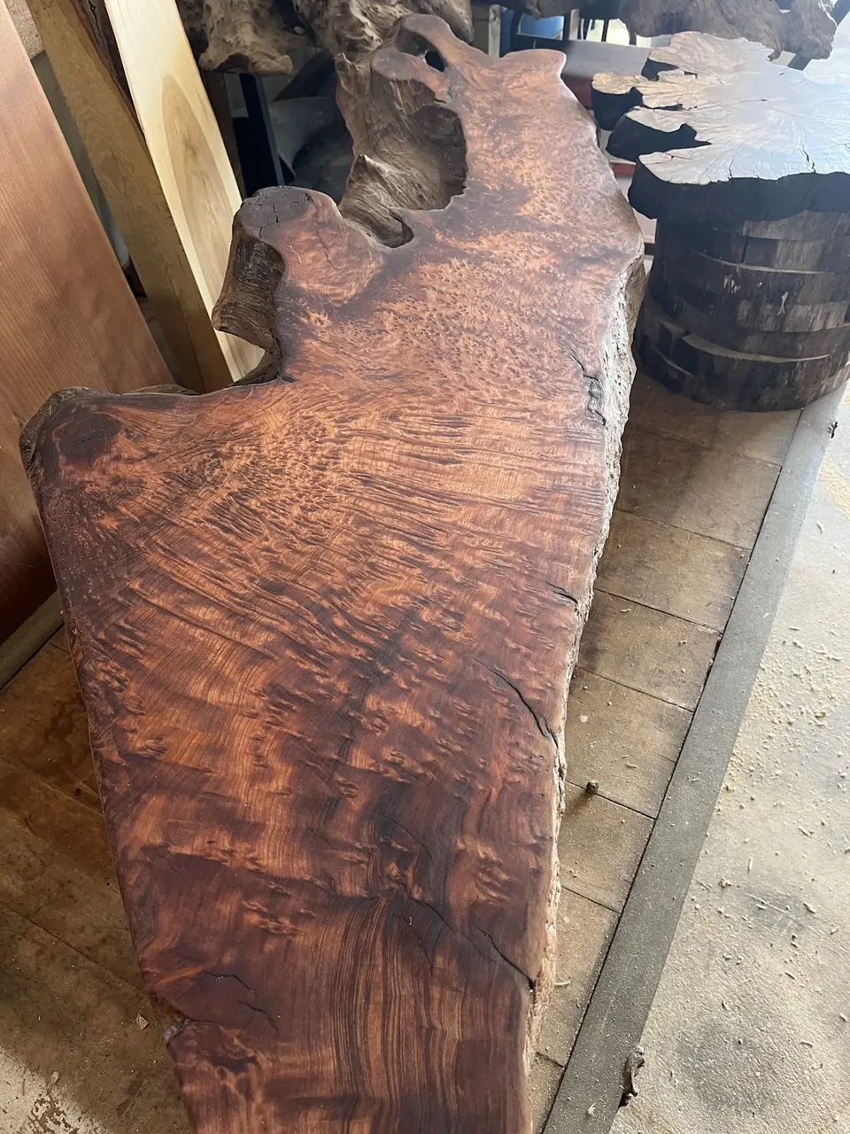 Curly figured walnut slab with a natural edge